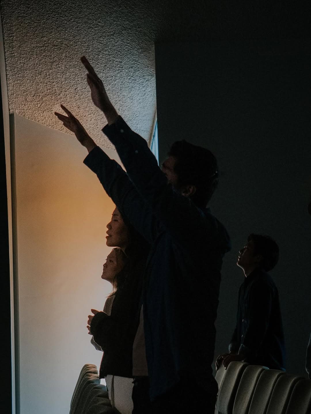 Silhouetted worship in golden light