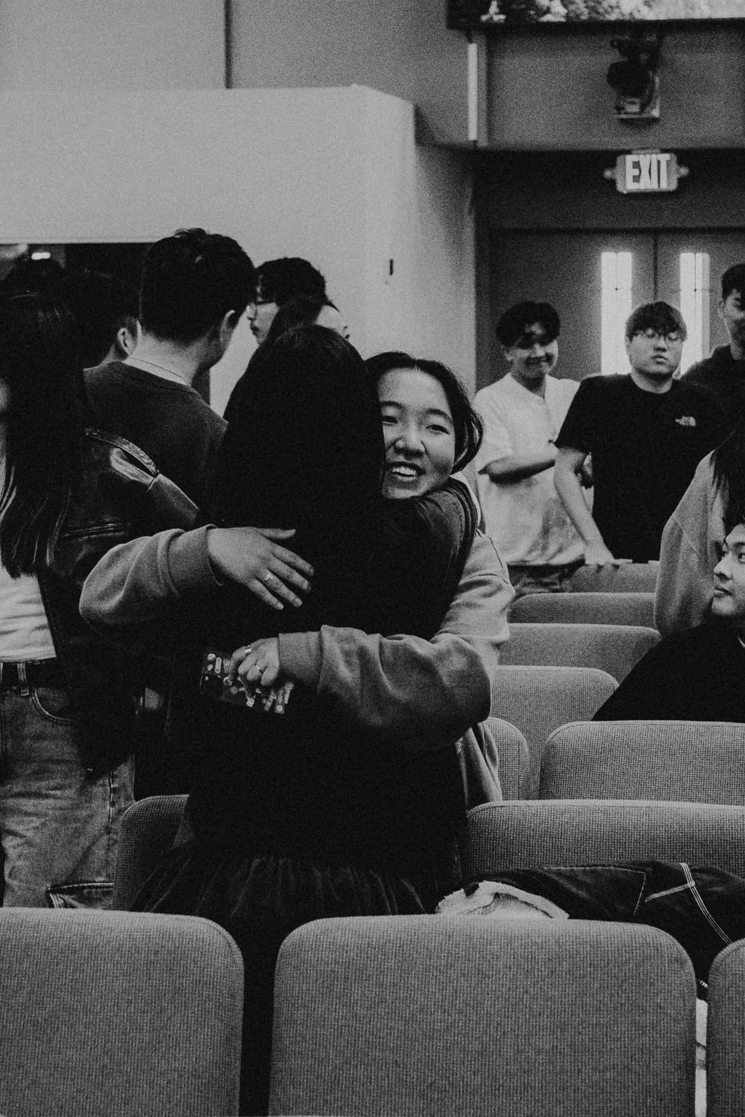 Community members embracing at 1128 Ministry